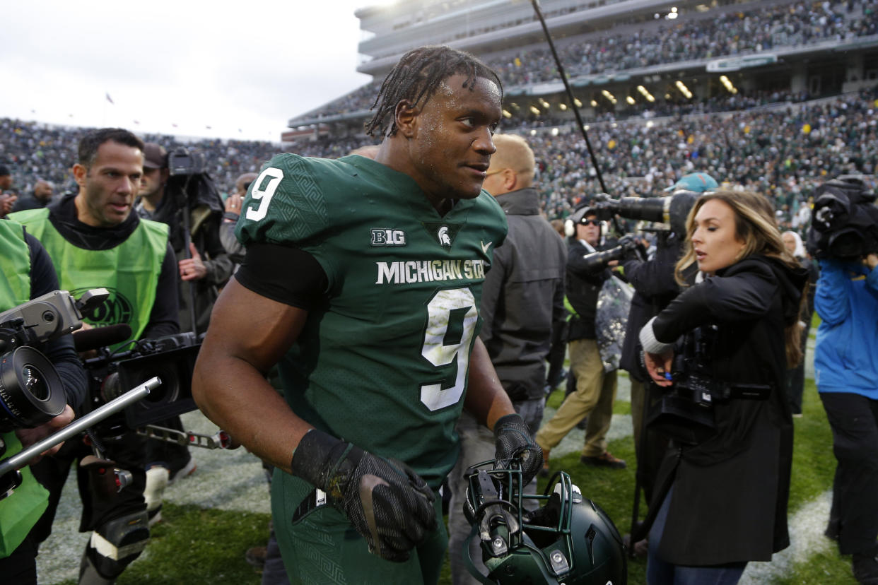 Michigan State's Kenneth Walker III runs off the field following an NCAA college football game against Michigan, Saturday, Oct. 30, 2021, in East Lansing, Mich. (AP Photo/Al Goldis)