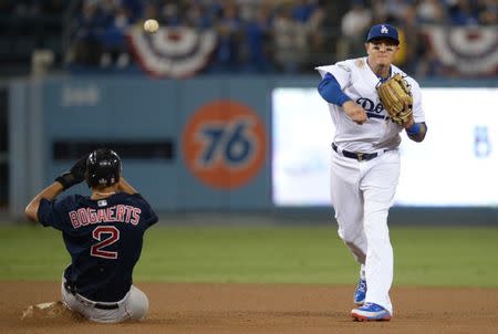 Oct 28, 2018; Los Angeles, CA, USA; Boston Red Sox shortstop Xander Bogaerts (2) is out at second against Los Angeles Dodgers shortstop Manny Machado (8) in the seventh inning in game five of the 2018 World Series at Dodger Stadium. Mandatory Credit: Gary A. Vasquez-USA TODAY Sports