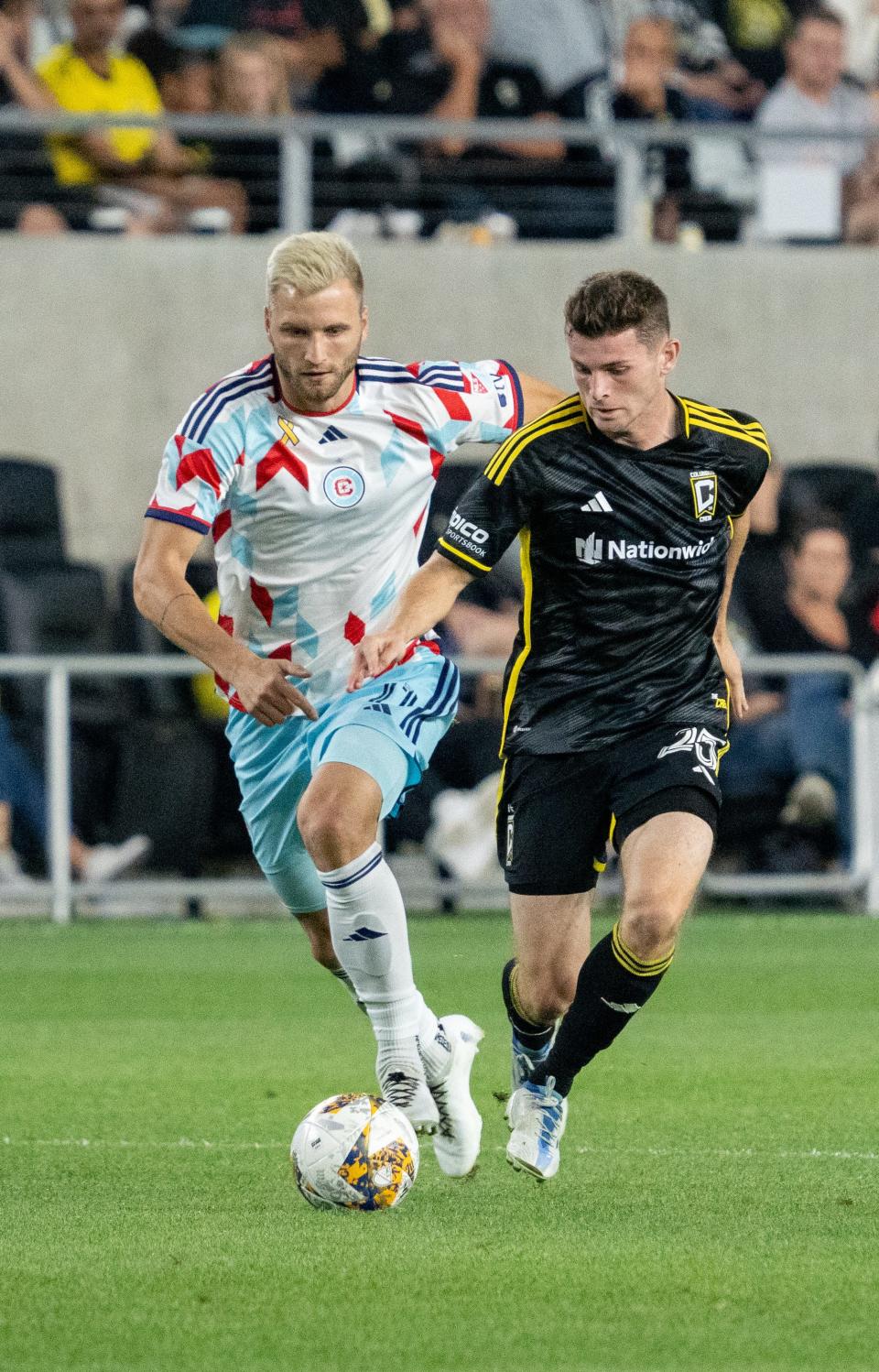 Sep 20, 2023; Columbus, Ohio, USA;
Columbus Crew midfielder Sean Zawadzki (25) races down the field against Chicago Fire forward Kacper Przybylko (11) during their game on Wednesday, Sept. 20, 2023.at Lower.com Field.
