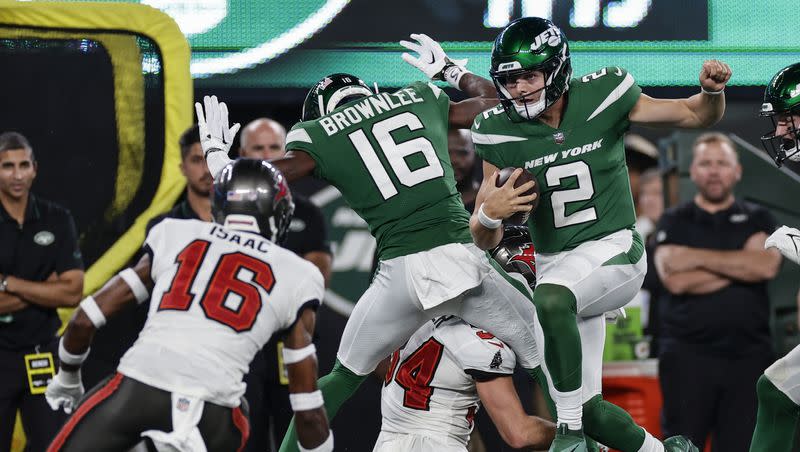 New York Jets quarterback Zach Wilson (2) runs for a 35-yard gain during a preseason NFL football game against the Tampa Bay Buccaneers, Saturday, Aug. 19, 2023, in East Rutherford, N.J.