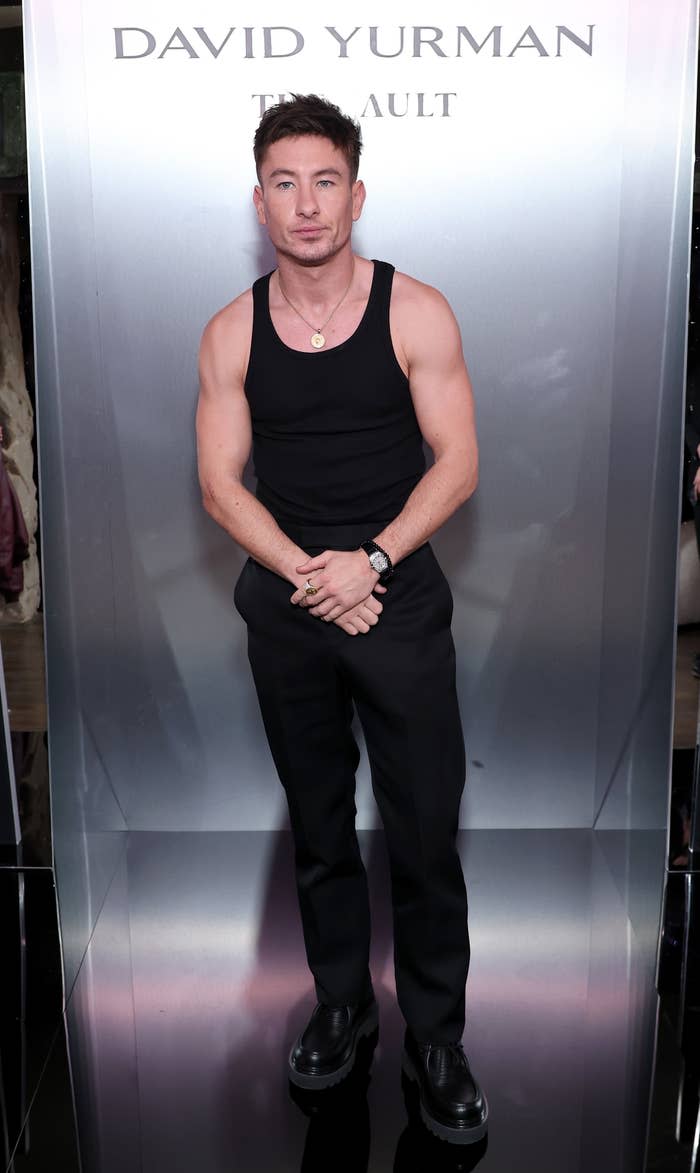 Man in black sleeveless top and pants at David Yurman event.