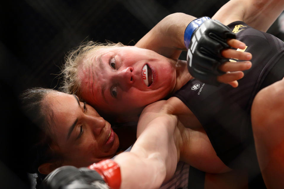 Valentina Shevchenko of Kyrgyzstan (R) battles Taila Santos of Brazil in the womens strawweight title bout during the UFC 275 event at Singapore Indoor Stadium on June 12, 2022 in Singapore.
 (Photo by Suhaimi Abdullah/NurPhoto via Getty Images)