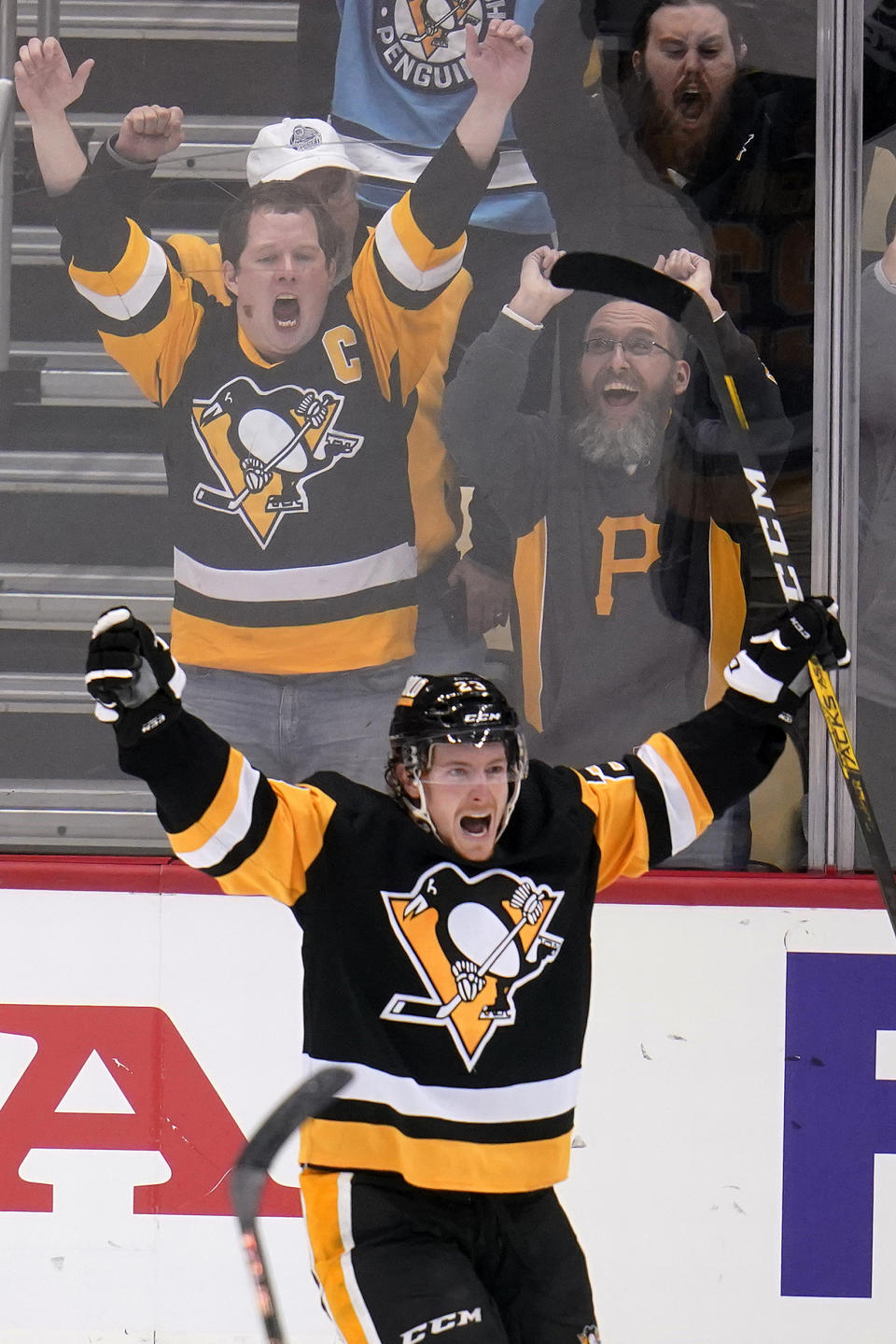 Pittsburgh Penguins' Brock McGinn celebrates his goal during the third period of an NHL hockey game against the St. Louis Blues in Pittsburgh, Wednesday, Jan. 5, 2022. The Penguins won 5-3. (AP Photo/Gene J. Puskar)