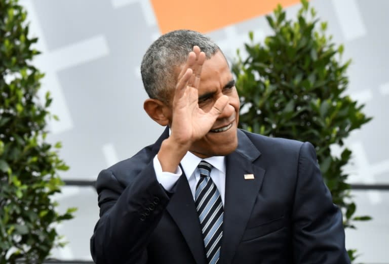 Former US president Barack Obama, seen here in Germany in May 2017, has largely kept silent as Trump moves to undo his legacy