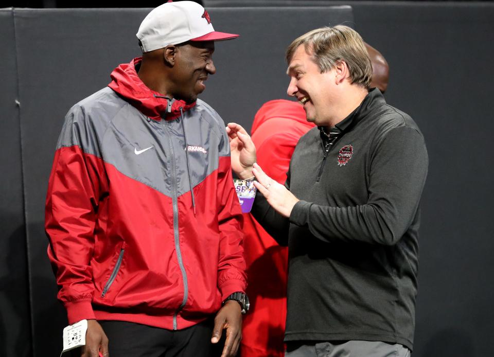 Georgia football coach Kirby Smart has a laugh with Arkansas running backs coach Jimmy Smith during the GHSA Class 3A State Championship game between Savannah Christian and Cedar Grove on Wednesday, December 13, 2023 at Mercedes-Benz Stadium in Atlanta, Georgia.