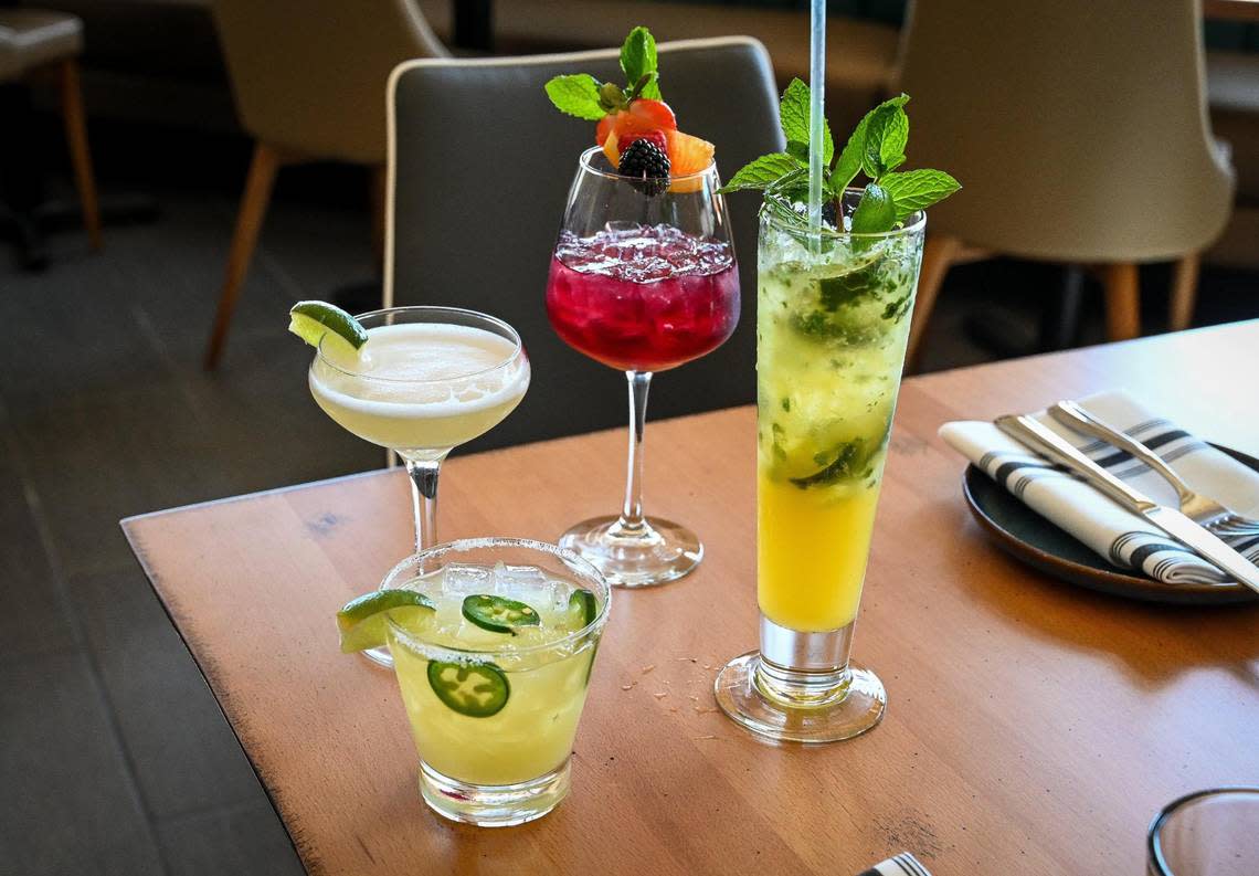 Various cocktails from Sabor Cocina Latina & Bar including, clockwise from top, red sangria, passion fruit mojito, margarita and pisco sour at their new location in the Park Place shopping center in north Fresno.