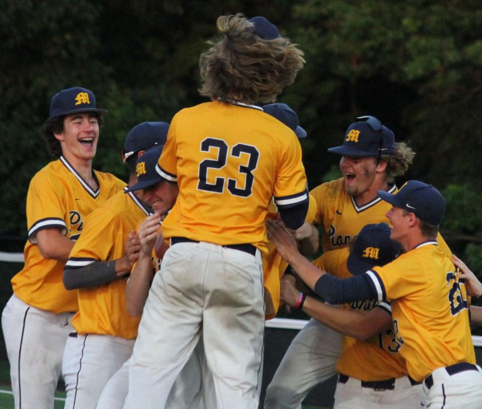 - Mooresville celebrates the IHSAA Sectional trophy after defeating Martinsville on Monday night at Center Grove. 