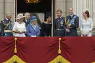 FILE - Britain's Queen Elizabeth II, at centre left, and from left, Prince Charles, Camilla the Duchess of Cornwall, Prince Andrew, Meghan the Duchess of Sussex, Prince Harry, Prince William and Kate the Duchess of Cambridge, as they watch a flypast of Royal Air Force aircraft pass over Buckingham Palace in London, July 10, 2018. Britain’s monarchy is bracing for more bombshells to be lobbed over the palace gates Thursday, Dec. 8, 2022 as Netflix releases the first three episodes of a series that promises to tell the “full truth” about Prince Harry and Meghan’s estrangement from the royal family. (AP Photo/Matt Dunham, file)