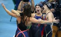 2016 Rio Olympics - Swimming - Final - Women's 4 x 200m Freestyle Relay Final - Olympic Aquatics Stadium - Rio de Janeiro, Brazil - 10/08/2016. Katie Ledecky (USA) of USA, Maya DiRado (USA) of USA, Leah Smith (USA) of USA and Allison Schmitt (USA) of USA celebrate winning the gold medal. REUTERS/Marcos Brindicci