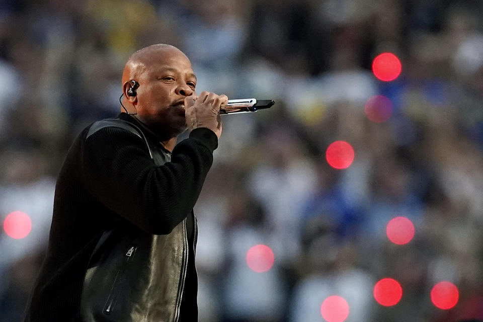 FILE - Dr. Dre performs during the halftime show during the NFL Super Bowl 56 football game, Feb. 13, 2022, in Inglewood, Calif. The signs of hip-hop’s influence are now everywhere from Pharrell Williams becoming Louis Vuitton’s men’s creative director to billion-dollar brands like Dr. Dre’s Beats headphones and retail mainstays like Diddy’s Sean John and the Rocawear line started by Jay-Z. It didn’t start out that way. Companies at first balked at partnering with hip-hop acts because they felt that the genre that appealed to Black and brown teens and young adults didn't align with their brands. (AP Photo/Steve Luciano, File)