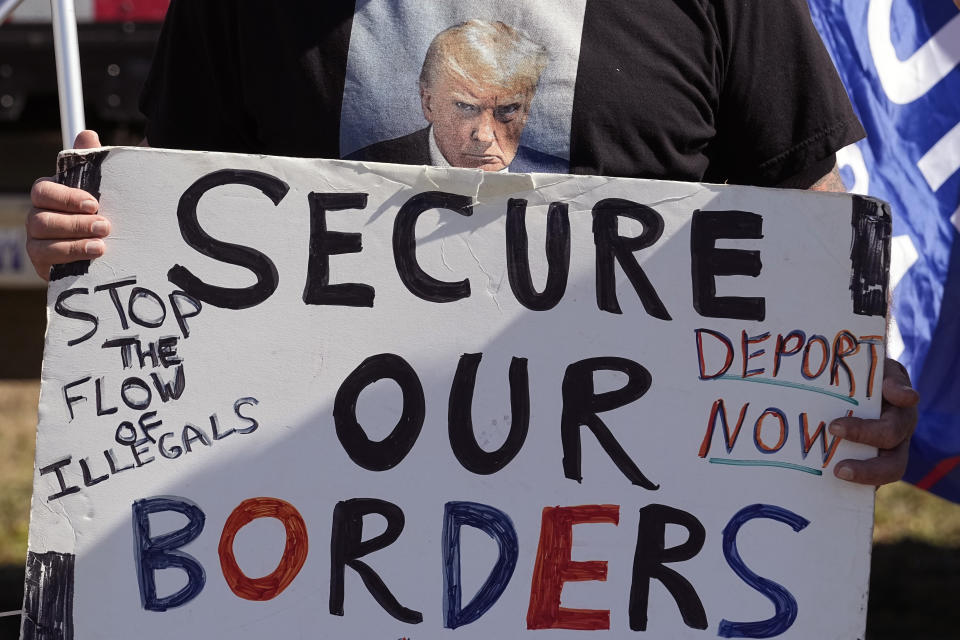 Phill Cady holds a sign during a "Take Our Border Back" rally, Saturday, Feb. 3, 2024, in Quemado, Texas. (AP Photo/Eric Gay)