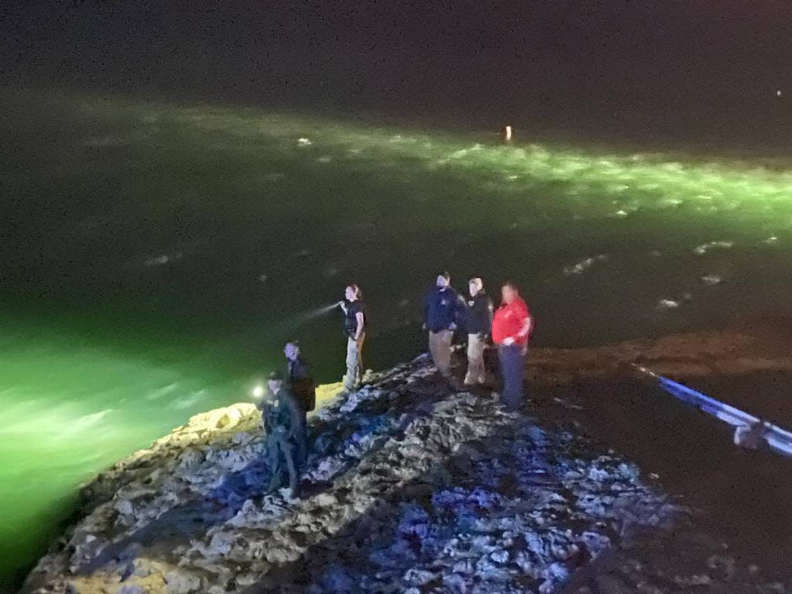 U.S. federal agents and police search for Haitian migrants after several jumped into the ocean off the Florida Keys.