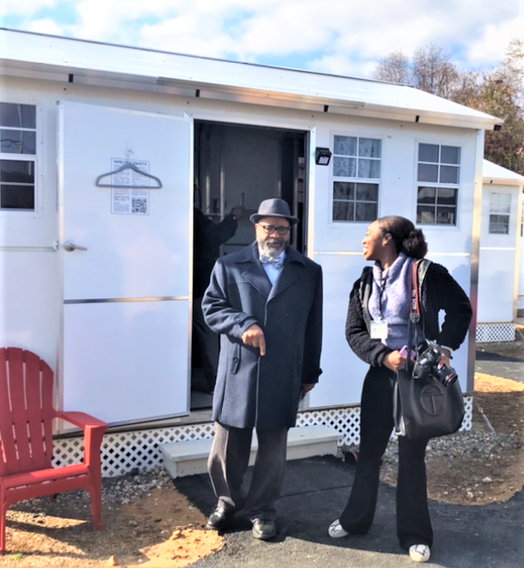 Bridgeton Mayor Albert Kelly emerges from one of the six `tiny homes' that make up the Village of Hope, a temporary shelter site for newly released prisoners. The village is a pilot program Kelly has spent about a year working on. Bridgeton is home to the county jail and South Woods State Prison. The village is at 5 West Industrial Boulevard in Bridgeton. Photo/Nov. 17, 2022