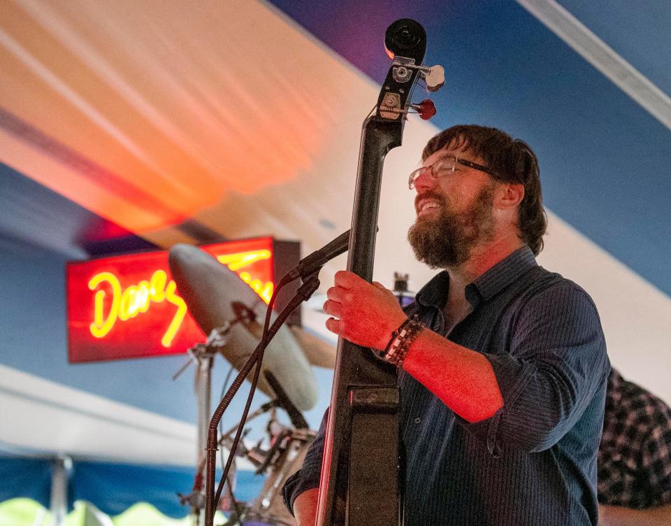 The bass player for the Dave Steffen Band gets in the groove during the Salmon Derby at the Manitowoc Marina during the Fourth of July festivities, Monday, July 4, 2022, in Manitowoc, Wiis.