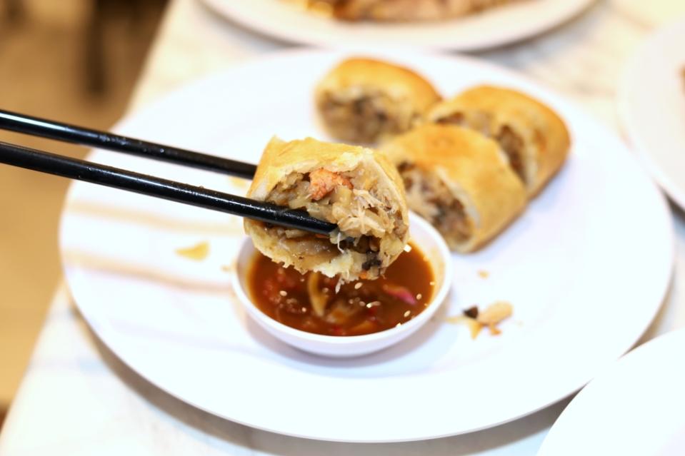 Dip your spring roll inside the piquant sauce.