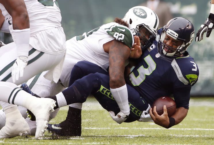 Russell Wilson is dealing with knee, ankle and pectoral injuries (AP)