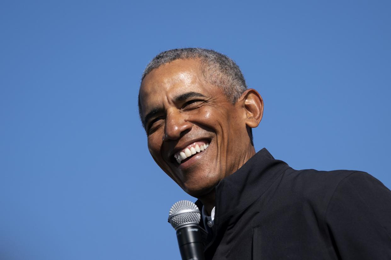 Former U.S. President Barack Obama speaks during a drive-in campaign rally for Democratic presidential nominee Joe Biden at Northwestern High School on October 31, 2020 in Flint, Michigan.