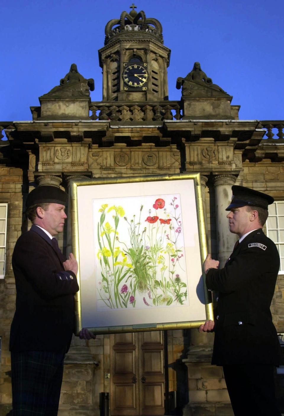 A painting by Dame Elizabeth Blackadder is carried in to the Palace of Holyroodhouse after she was appointed Her Majesty’s Painter and Limner (Ben Curtis/PA) (PA Archive)