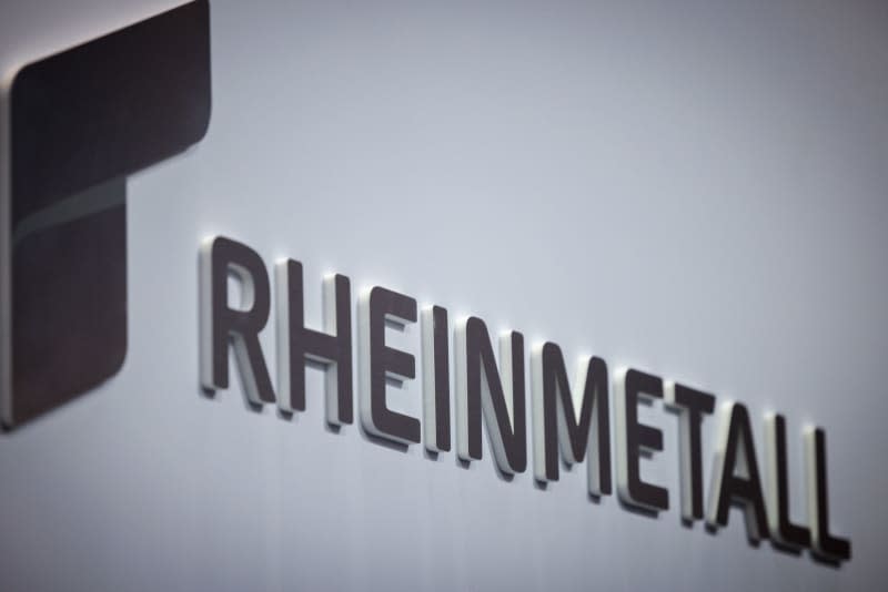 The Rheinmetall logo pictured on the company's stand at the Enforce Tac trade fair for security technology. Daniel Karmann/dpa
