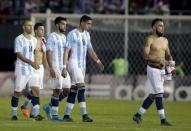 Argentina's soccer players leave the field after their 2018 World Cup qualifying soccer match against Paraguay at the Defensores del Chaco stadium in Asuncion, Paraguay, October 13, 2015. REUTERS/Jorge Adorno
