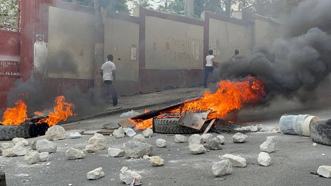 In Haiti’s capital of Port-au-Prince, streets were barricaded with flaming tires and parked vehicles on Monday, Feb. 5, 2024 as part of a countrywide mobilization effort announced by opponents of Prime Minister Ariel Henry to force him from office ahead of Wednesday, Feb. 7, 2024.