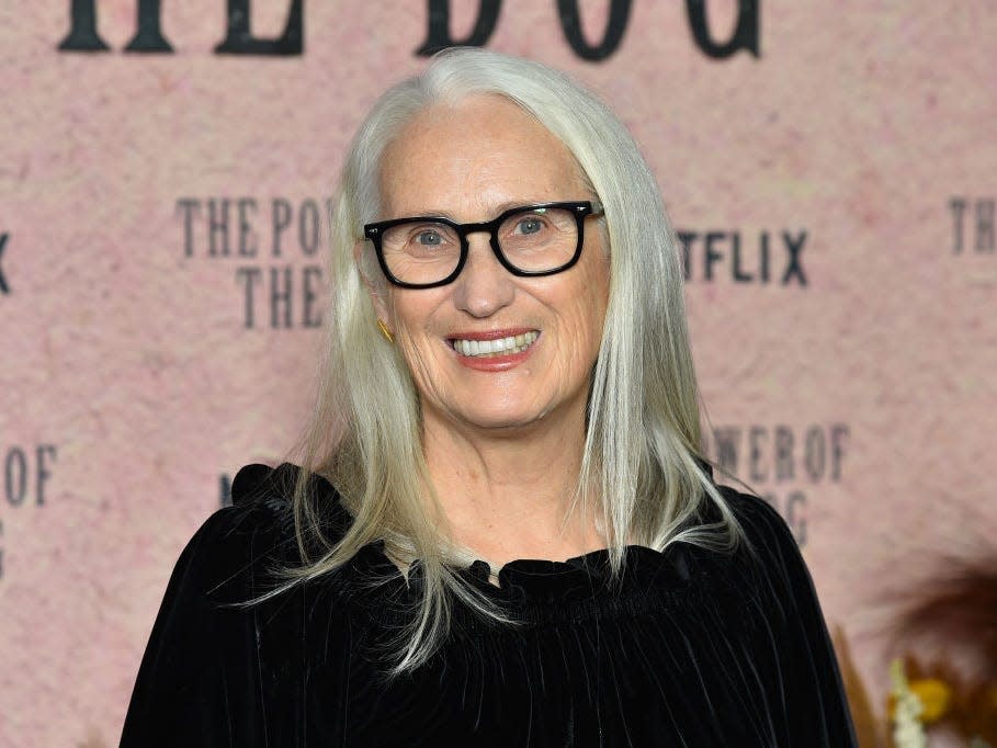 Director Jane Campion at an event. She has shoulder-length grey hair and glasses.