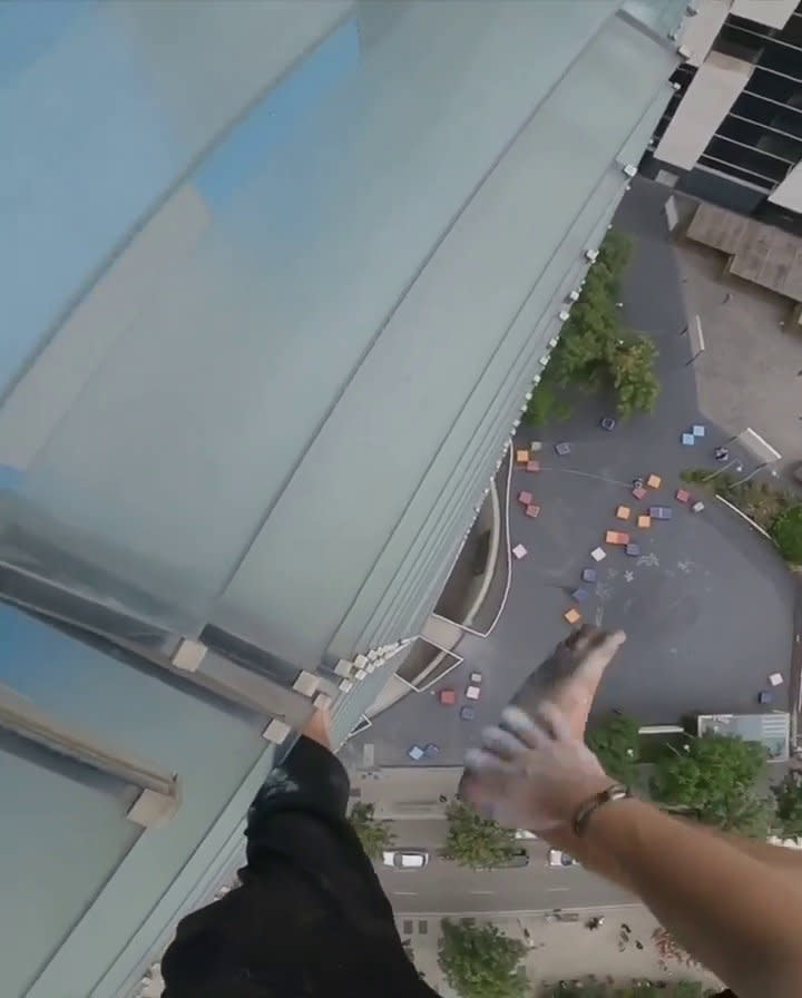 Adam Lockwood, 19, is no stranger to vertigo-inducing free climbing, having been successfully scaling buildings of up to 200 metres in the UK and Europe for the last two years, without any equipment. But his latest venture earlier this week saw Adam add a new challenge to his climbing. For the first time, Adam took on a skyscraper building - the 144-metre (472 feet) Torre Agbar tower in Barcelona, Spain - completely barefoot. The teen, from Manchester, had to keep stopping to rub chalk on his feet to help his grip, as he climbed the ladder-like structure on the outside of the office block.