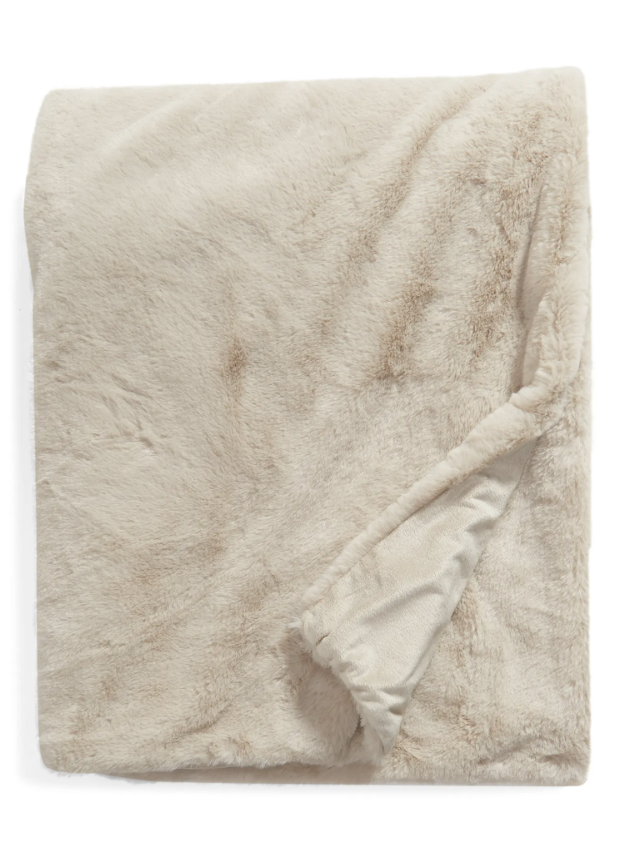 Nordstrom Recycled Faux Fur Throw Blanket in ivory white (Photo via Nordstrom)