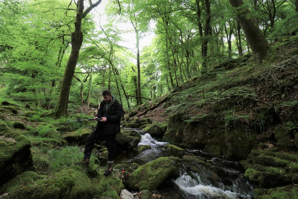 PhD researcher Brogan Pett taking notes