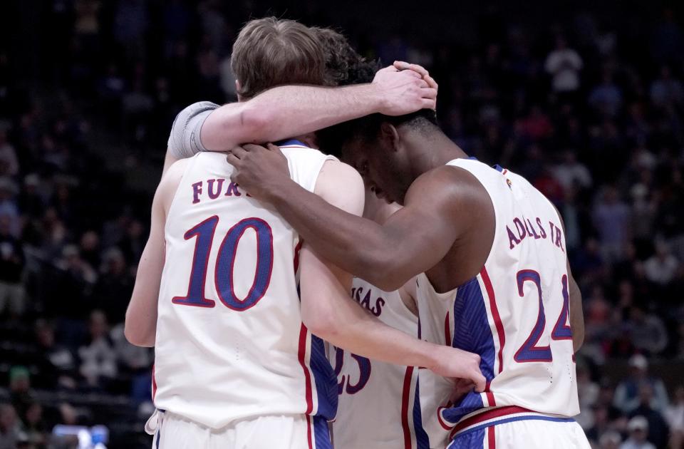 Kansas basketball guard Johnny Furphy huddles with teammates during the second half of a NCAA tournament game in March against Samford in Salt Lake City, Utah.