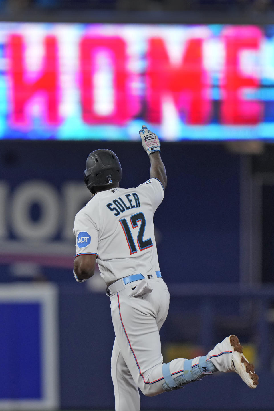 Miami Marlins' Jorge Soler celebrates as he rounds second base after hitting a home run scoring Luis Arraez during the third inning of a baseball game against the Washington Nationals, Sunday, Aug. 27, 2023, in Miami. (AP Photo/Wilfredo Lee)