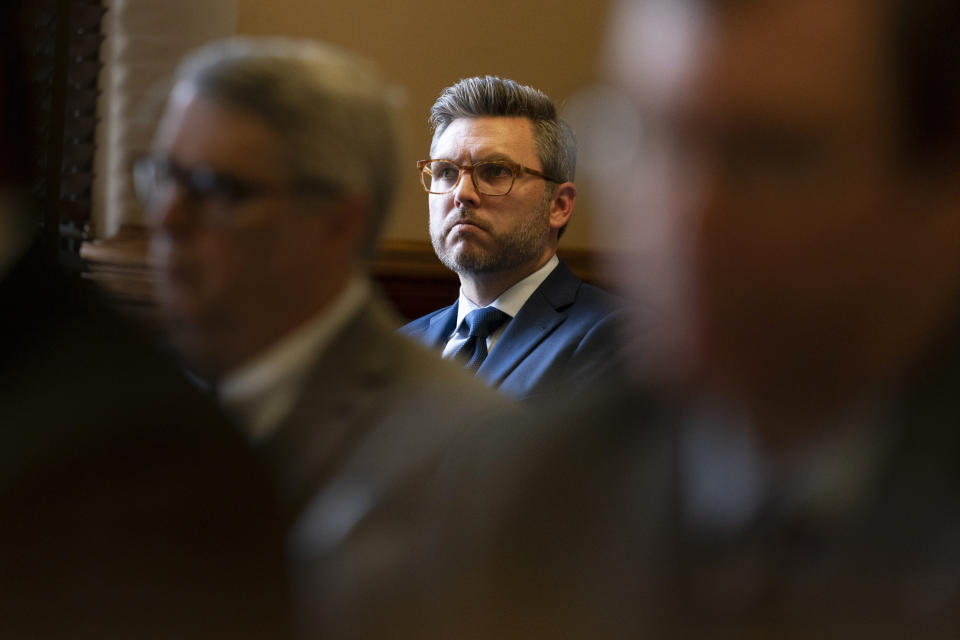 FILE - Covenant School parent Brent Leatherwood, center, listens during a status hearing in Chancellor I'Ashea L. Myles courtroom involving the release of records related to the the March school shooting Monday, May 22, 2023 in Nashville, Tenn. Leatherwood is part of a group whose children attend The Covenant School. The group is trying to keep the shooter's writings from being released to the public. (AP Photo/George Walker IV)