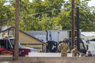 Military personnel investigate an airplane crash near Nellis Air Force Base on Monday, May 24, 2021, in Las Vegas. (L.E. Baskow/Las Vegas Review-Journal via AP)