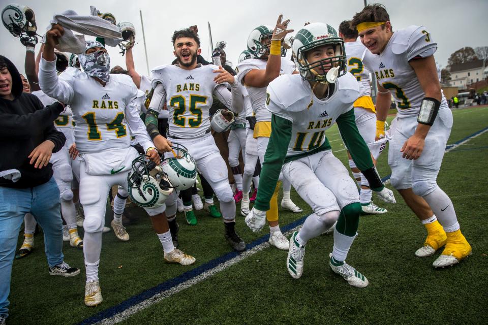 Lynn Classical players celebrate their 22-9 win against Lynn English after the Thanksgiving Day high school football game at Manning Field in Lynn, MA on Nov. 28, 2019.