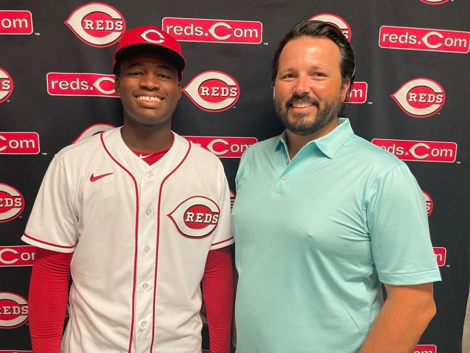 Joe Katuska, right, stands with Cam Collier, Katuska's first draft pick after taking over as the scouting director for the Cincinnati Reds.