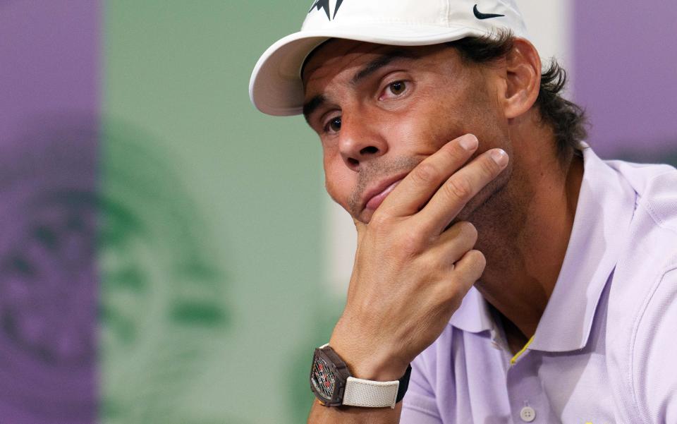 Spain's Rafael Nadal holds a press conference on the eleventh day of the 2022 Wimbledon Championships at The All England Tennis Club in Wimbledon, southwest London, on July 7, 2022. - Rafael Nadal announced today that he is withdrawing from Wimbledon after failing to recover from an abdominal injury. - RESTRICTED TO EDITORIAL USE (Photo by Andrew TOTH / various sources / AFP) / RESTRICTED TO EDITORIAL USE (Photo by ANDREW TOTH/AFP via Getty Images)