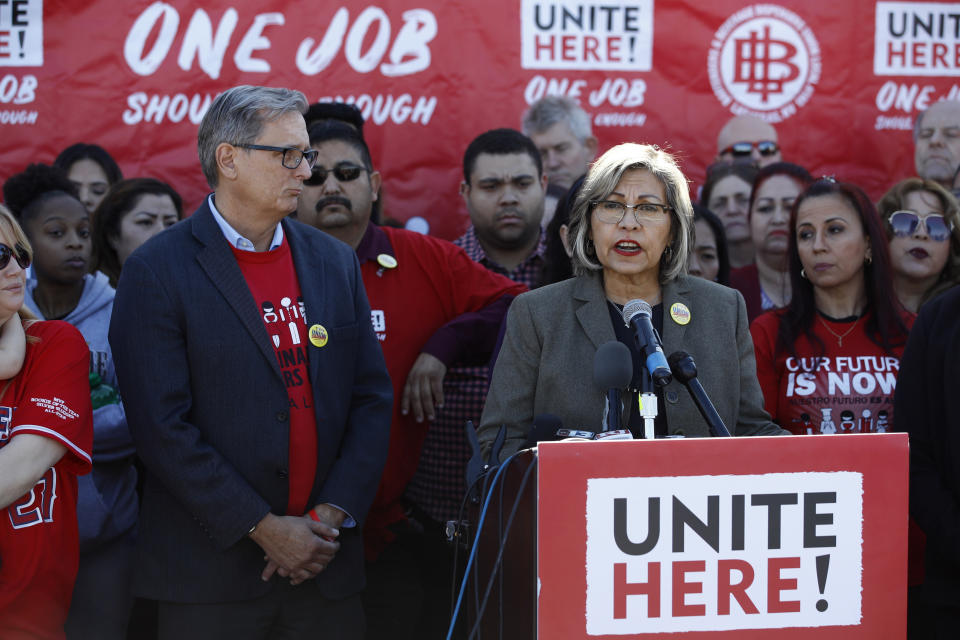 Geoconda Arguello-Kline, right, Secretary-Treasurer of the Culinary Union, speaks at a news conference to announce the union's decision to stay out of the state's Democratic presidential caucuses and not endorse a candidate, Thursday, Feb. 13, 2020, in Las Vegas. (AP Photo/Patrick Semansky)