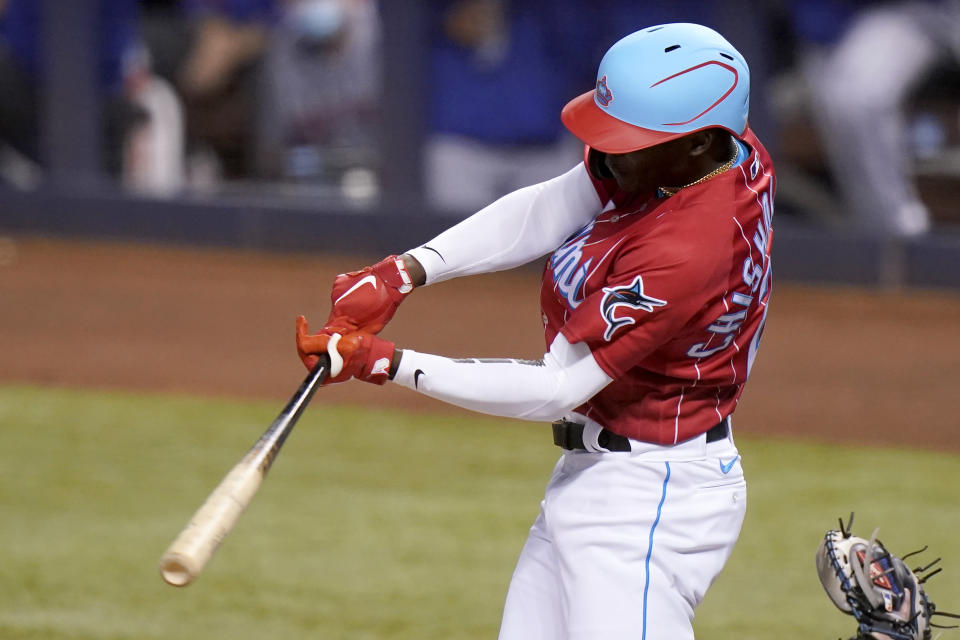 Miami Marlins' Jazz Chisholm Jr. hits a single during the first inning of the team's baseball game against the New York Mets, Friday, May 21, 2021, in Miami. (AP Photo/Lynne Sladky)