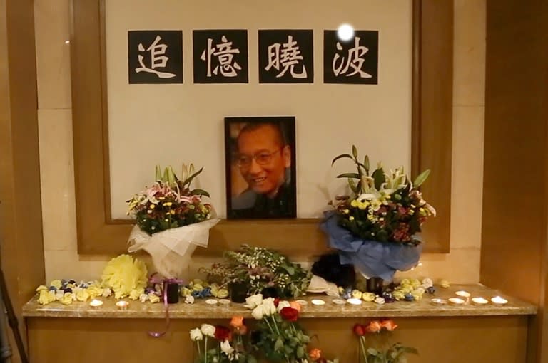 Under the shadow of heavy police surveillance, around 20 close friends of China's late Nobel laureate and dissident Liu Xiaobo have held a defiant private memorial in Beijing