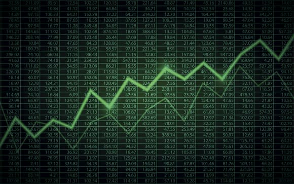 Green line graph going up with numbers in the background.