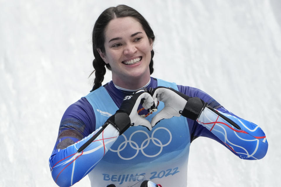 FILE - Summer Britcher, of the United States, finishes the luge women's singles run 3 at the 2022 Winter Olympics, Tuesday, Feb. 8, 2022, in the Yanqing district of Beijing. Summer Britcher and Emily Sweeney have been USA Luge teammates for years. They’ve traveled together, they’ve competed together, they’ve gone to the Olympics together, they’ve stood on World Cup podiums together. Being on a sled together was not part of the plan.(AP Photo/Pavel Golovkin, File)