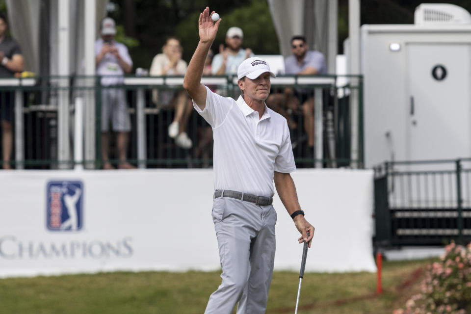 Steve Stricker waves to the fans after finishing on the 18th hole during the final day at the Regions Tradition, a PGA Tour Champions golf event, Sunday, May 15, 2022, in Birmingham, Ala. Stricker won the tournament by six strokes at 21-under par. (AP Photo/Vasha Hunt)