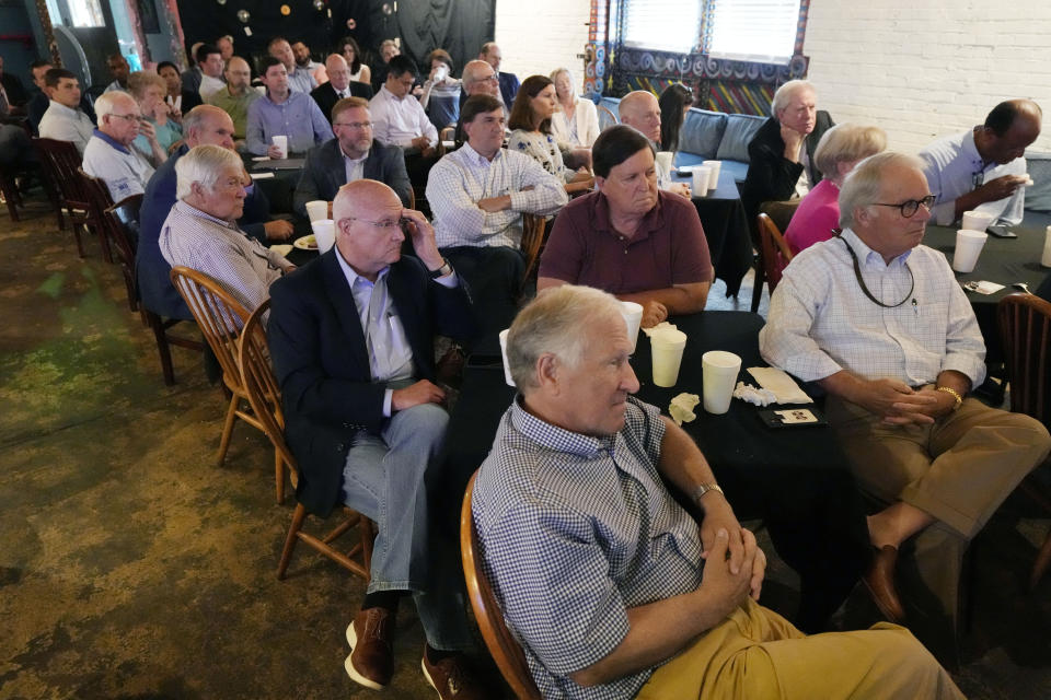 Attendees of the Stennis-Capitol Press Corps lunch listen as Ted Henifin, the interim third-party manager appointed by the U.S. Department of Justice to help fix the long-troubled water system of Mississippi's capital city, speaks about the expansive list of reforms the city's water department is undertaking, Monday, June 5, 2023, in Jackson. (AP Photo/Rogelio V. Solis)