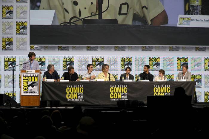 Karl Jacobs, Jeremy Latcham, Jonathan Goldstein, John Francis Daley, Chris Pine, Michelle Rodriguez, Regé-Jean Page, Sophia Lillis, and Hugh Grant at a panel