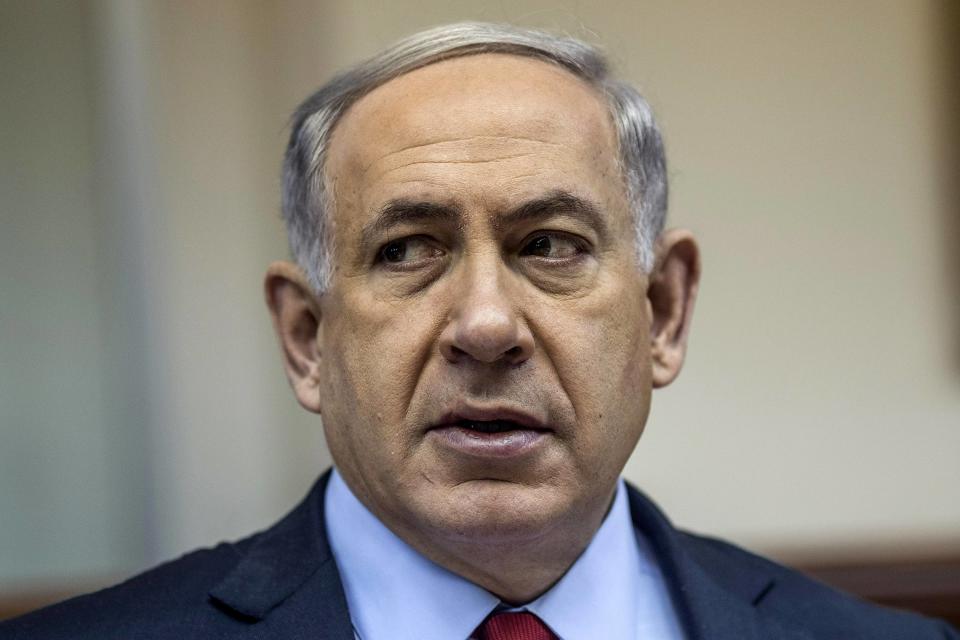 Israel's Prime Minister Benjamin Netanyahu attends the weekly cabinet meeting at his office in Jerusalem December 14, 2014. REUTERS/Oliver Weiken/Pool (JERUSALEM - Tags: POLITICS HEADSHOT)