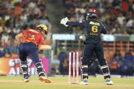 Punjab Kings' Jonny Bairstow gets bowled out by Gujarat Titans' Noor Ahmad during the Indian Premier League cricket match between Gujarat Titans and Punjab Kings in Ahmedabad, India, Thursday, April 4, 2024. (AP Photo/STR)