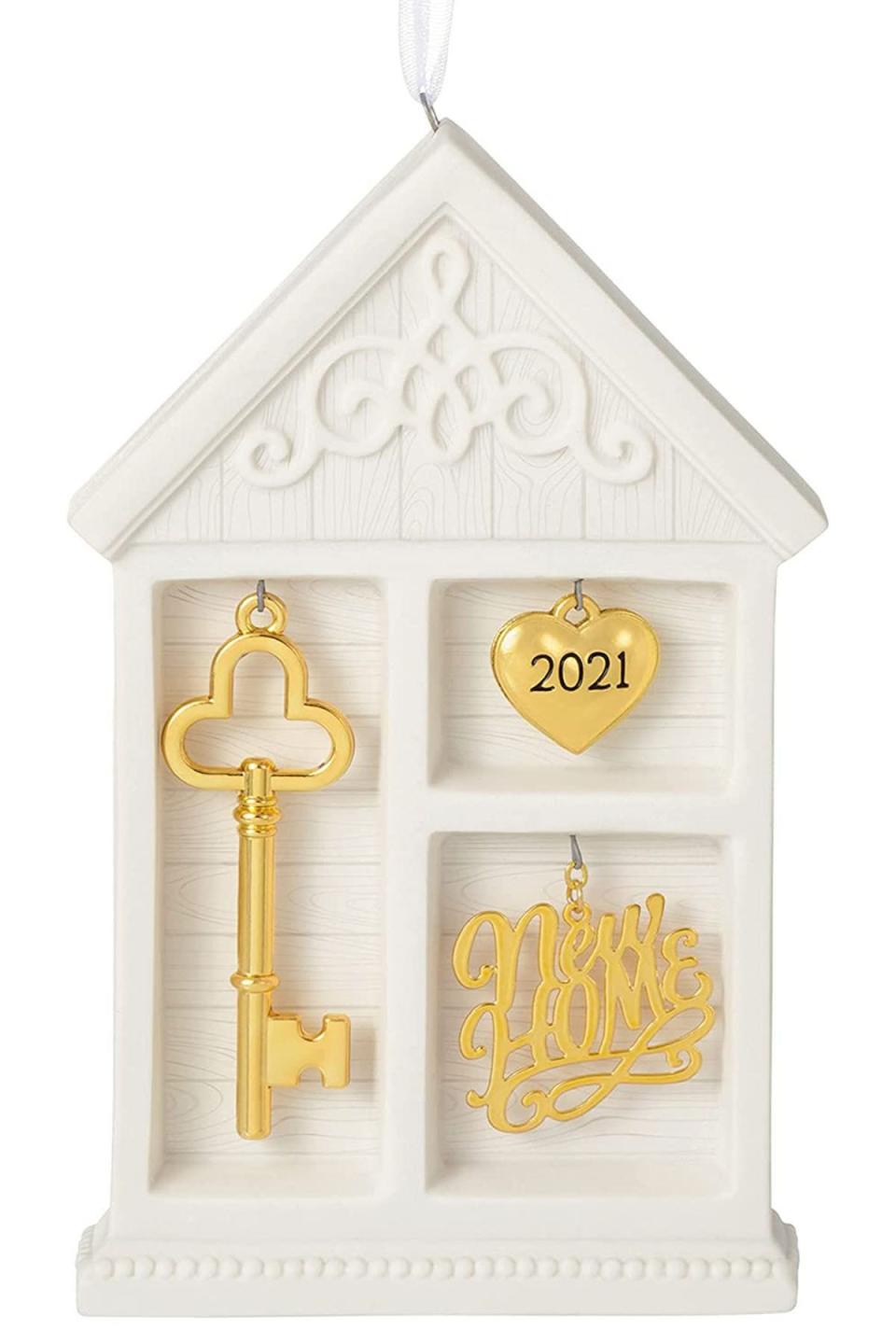 <p><strong>Hallmark Keepsake</strong></p><p>amazon.com</p><p><strong>$19.95</strong></p><p><a href="https://www.amazon.com/dp/B08K3MZD8H?tag=syn-yahoo-20&ascsubtag=%5Bartid%7C10050.g.4838%5Bsrc%7Cyahoo-us" rel="nofollow noopener" target="_blank" data-ylk="slk:Shop Now;elm:context_link;itc:0;sec:content-canvas" class="link ">Shop Now</a></p><p>This special gift is something they'll enjoy year after year. Every December when they decorate the tree, they'll put this up and remember the exciting year they first moved into this home. </p>