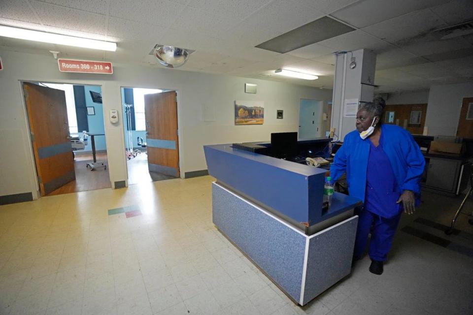 Alliance Healthcare System hospital Environmental Service Manager Ardency Baird checks on empty hospital beds in one of the shut-down floors of the Holly Springs facility.