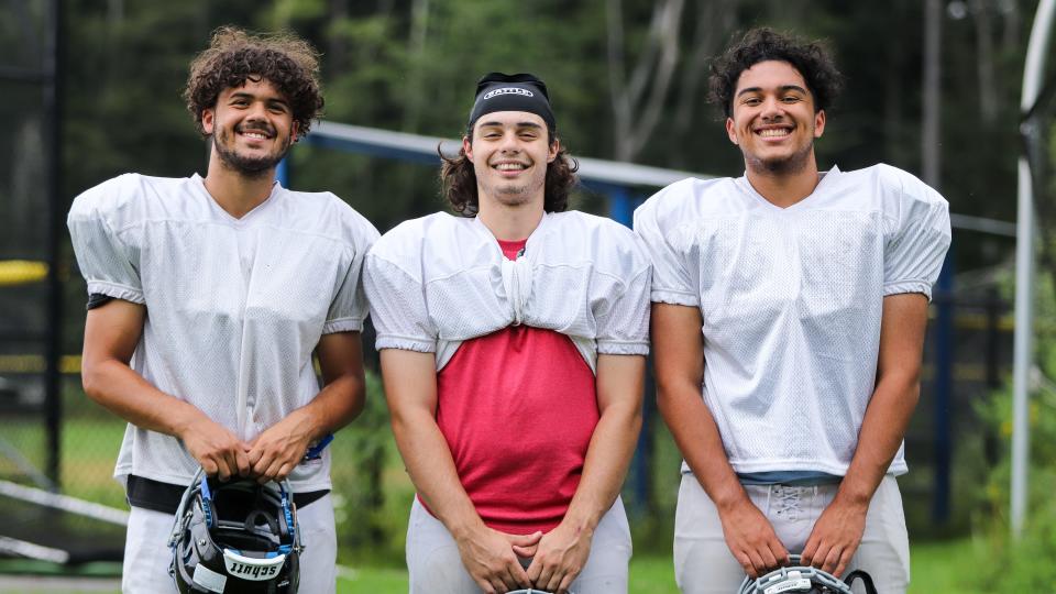 From left, Holbrook/Avon football captains Jordan Cioffi, Chuck Luarasi and Johan Rodriguez during a practice Tuesday, Aug. 29, 2023.