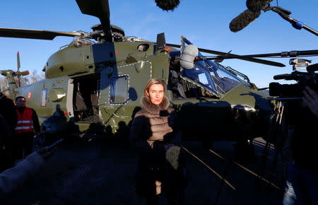 European Union foreign policy chief Federica Mogherini (C) talks to reporters during the Black Blade military exercise involving several European Union countries and organised by the European Defence Agency, at Florennes airbase, Belgium November 30, 2016. REUTERS/Yves Herman